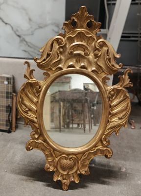 a mirror that is sitting on a table in a room