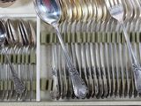 many spoons and spoons in a drawer with silverware in it