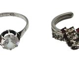 two rings that are sitting side by side on a white background