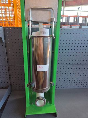 a large metal tank sitting on a stand in a store