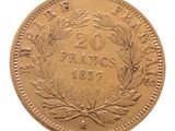 l'image d'une pièce d'or ornée d'une couronne sur l'avers