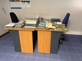 a desk with a lot of books on it