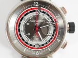 a close up of a wrist watch with a red second hand