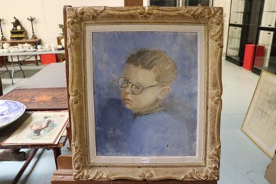 a painting of a young boy with glasses on a table