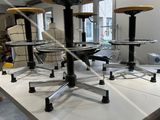 a table that has a bunch of stools on it