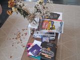 a coffee table with a bunch of books on top of it