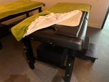 a massage table with a towel on top of it