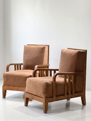 pair of mid - century style armchairs in the manner of paul mcclach