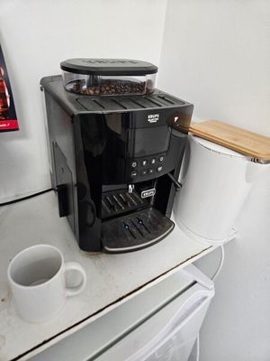 a coffee maker sitting on a counter in a kitchen