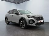 a silver suv parked in a large room with a white wall