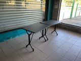 a table that is sitting in front of a window