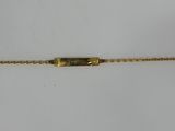 a close up of a gold bracelet with a clasp on a white background