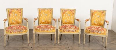four chairs with a yellow upholstered back and a red and gold upholstered back