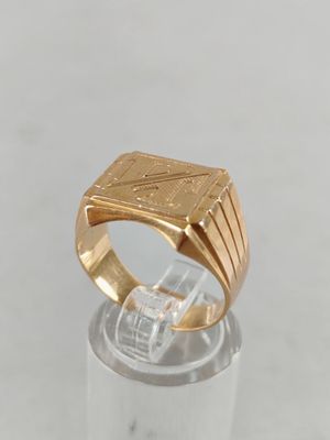 an image of a gold ring with a diamond in the center