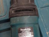 a drill that is sitting on top of a blue box