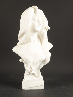 a white statue of a woman with a veil on her head