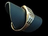 an image of a gold ring on a black background
