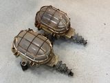 two lamps that are sitting on the floor