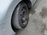a car that has a flat tire on the side of the road