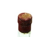 a bottle of alcohol with a cork on the top