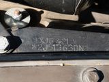 a close up of a car ' s engine with a number on it