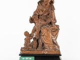 an image of a statue of a woman holding a child