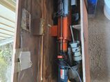 a small cabinet with a drill and a drillet in it
