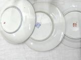 three plates that are sitting on a table