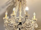 a chandelier hanging from the ceiling in a room