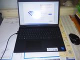 a laptop computer sitting on top of a desk with a mouse