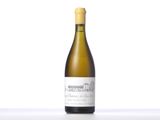 a bottle of white wine sitting on top of a table