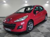 a picture of a red car that is parked in a garage