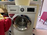 a washing machine that is sitting on the floor