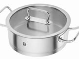 a close up of a stainless steel pot with a lid on a white background