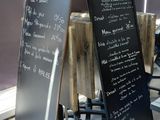 a menu on a blackboard in a restaurant