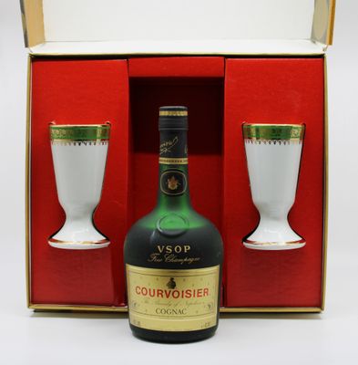 a bottle of courvoisier and two cups in a box