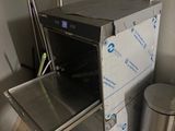 a small oven that is sitting in the corner of a room
