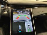 a close up of a car dashboard with a tablet on it