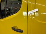 a yellow van with a sticker on the side of it