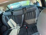 the back seats of a car are empty in the back of the car