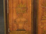 pair of antique wooden cabinet doors decorated with flowers and leaves