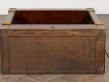 a wooden box that is sitting on the floor