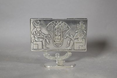 an image of a silver plate with an image of a man and a woman on it