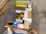 a cart full of boxes and other items in a warehouse