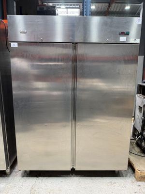 two stainless steel refrigerators in a warehouse area