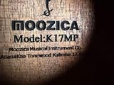 a close up of a clock on a wooden table