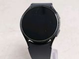 a smart watch sitting on top of a plastic stand
