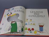 an open book with a picture of an elephant wearing a crown