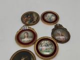 a lot of miniature pictures on a white table