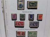 two books with different stamps on them sitting on top of a table